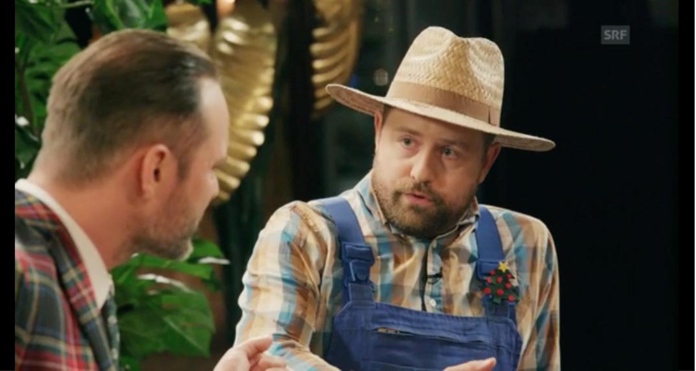 Wolfgang Imholz Nussbaum zu Gast bei Schweizer Komiker Dominic Deville. (Screenshot SRF)