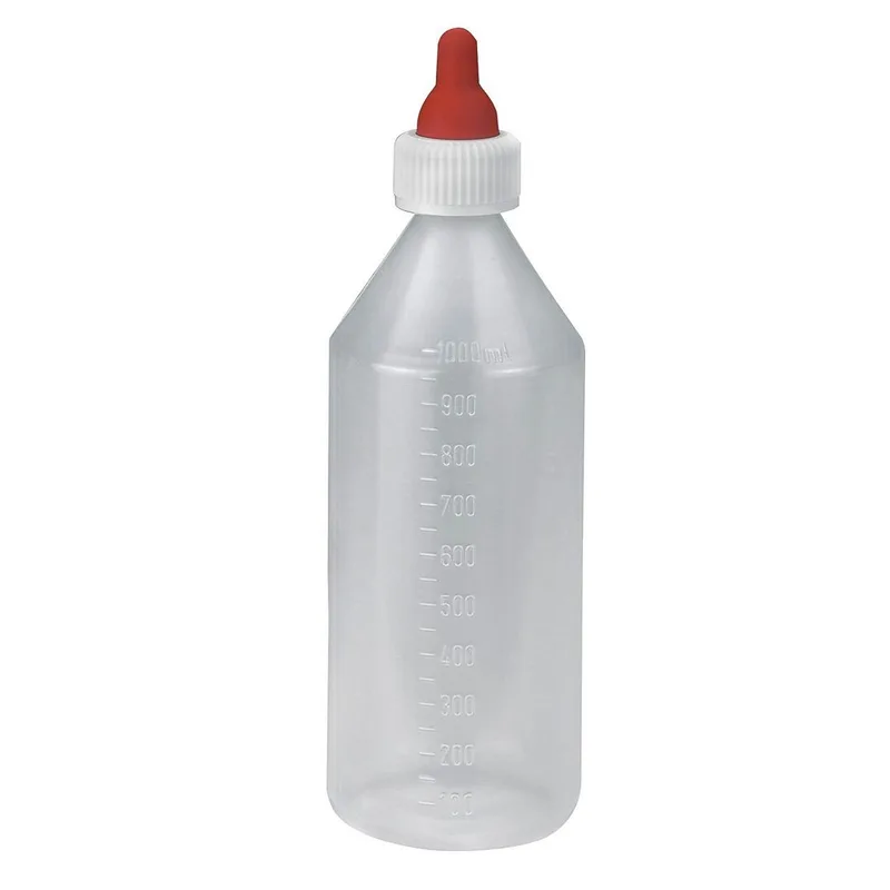 Eine weisse Plastikflasche mit einem roten Schnuller auf der Trinköffnung.